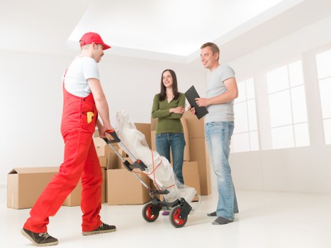 A local small removals team loading items for transport